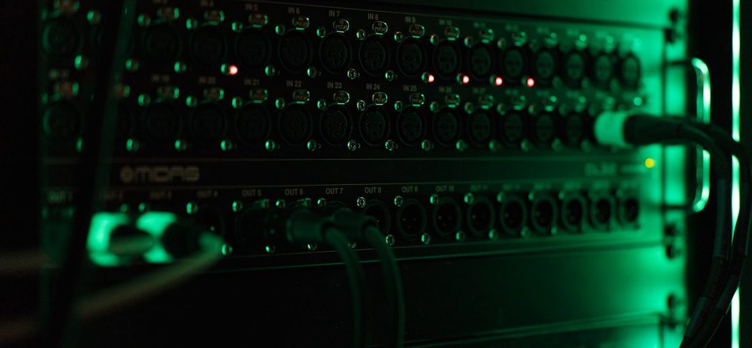 a close up of a computer with green lights server room network switches cables 1