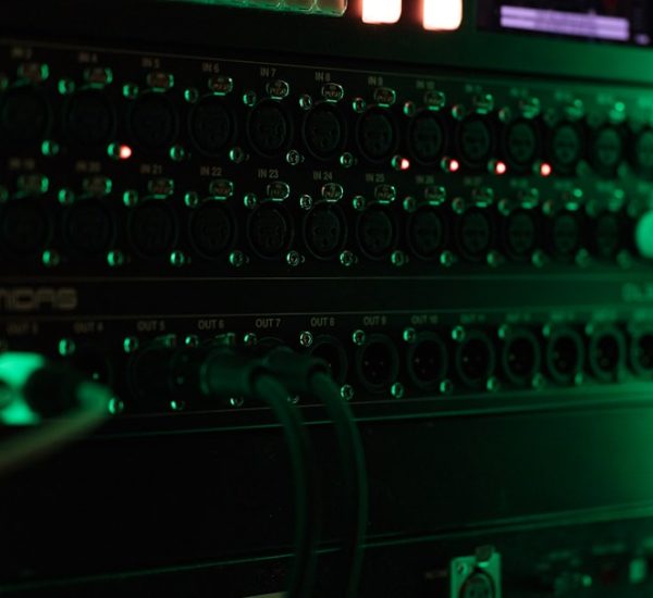 a close up of a computer with green lights server room network switches cables 1
