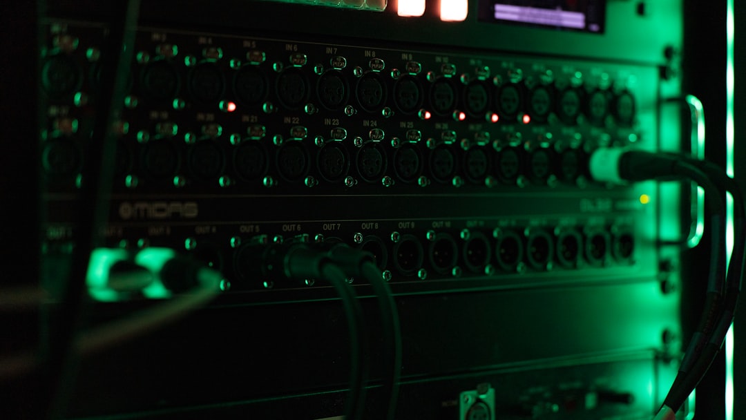 a close up of a computer with green lights server room network switches cables 1