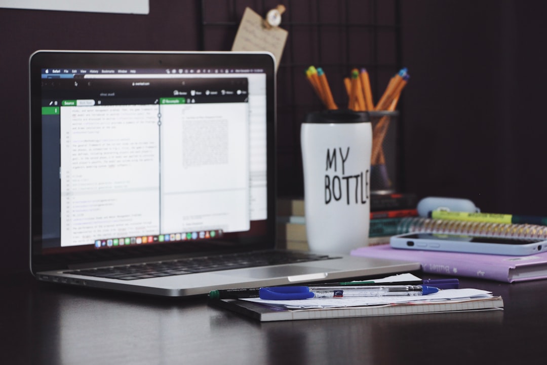 a laptop with a cup of coffee administrator laptop class schedule education software