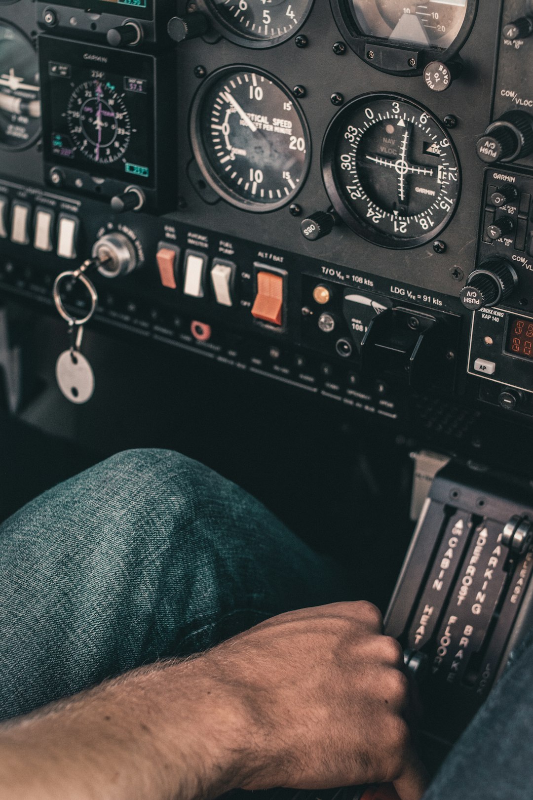 a man sitting in the cockpit of a plane flight instructor student pilot ground lesson airplane model