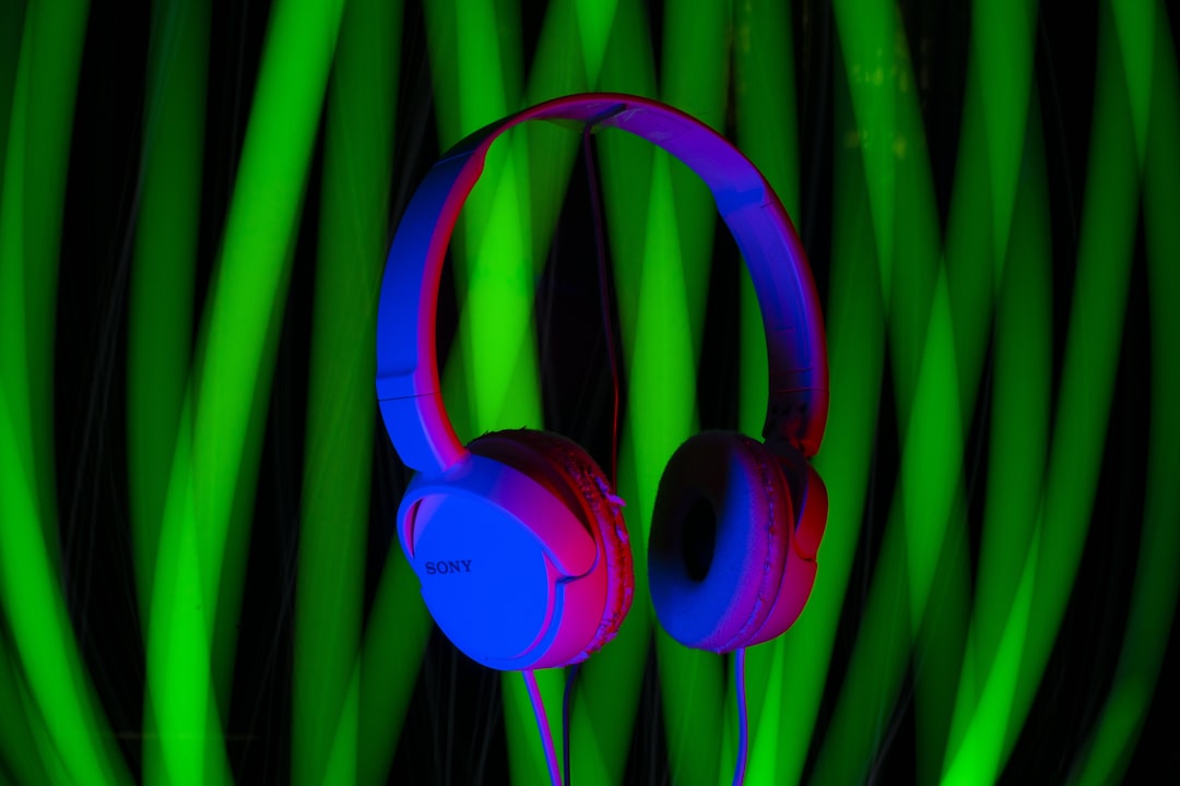 a pair of headphones sitting on top of a table playlist filters headphones colorful music
