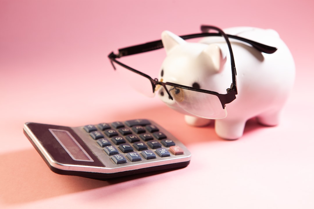 a piggy bank wearing glasses next to a calculator budget planning subscription pricing team savings