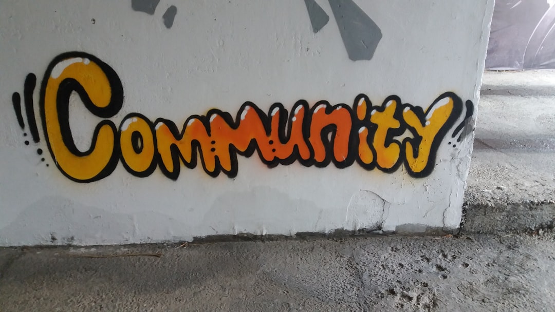 a wall that has some graffiti on it activists secure sharing community work