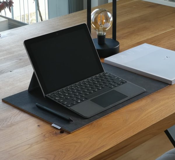 7 Best Law Firm Accounting Software Platforms 9 black and silver laptop computer on brown wooden table surface pen touchscreen drawing digital notes 3
