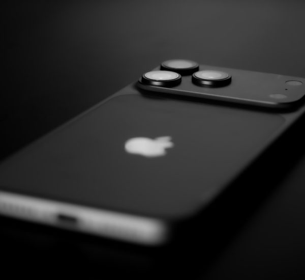 black smartphone with three camera lenses on back blue iphone concept premium smartphone glossy titanium dark background