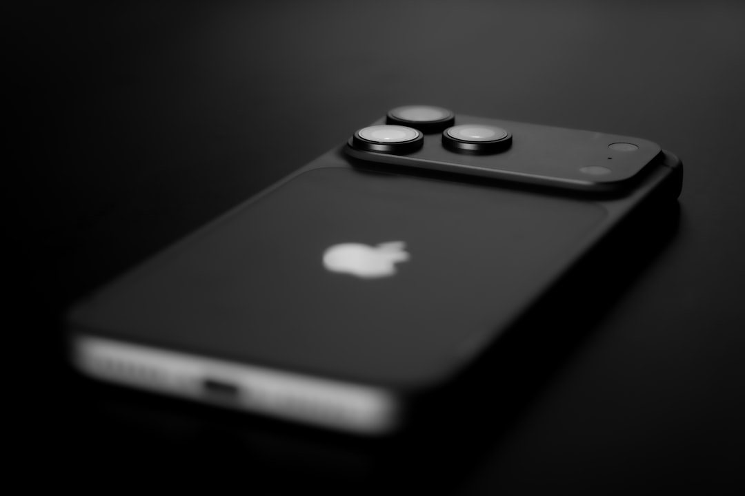 black smartphone with three camera lenses on back blue iphone concept premium smartphone glossy titanium dark background