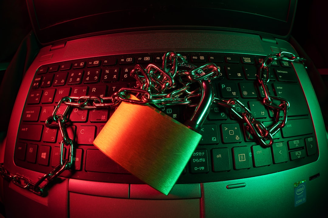 brown padlock on black computer keyboard website security shield icon laptop lock