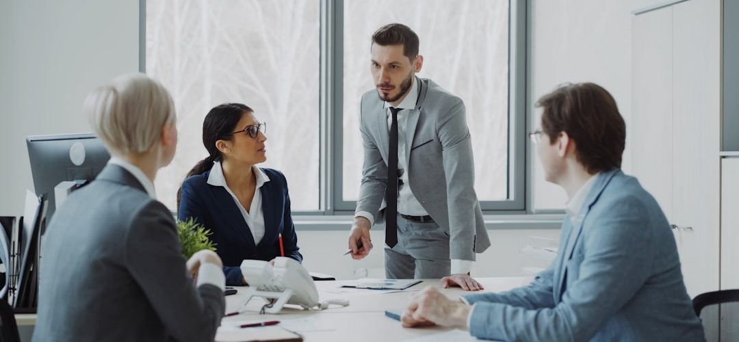 business professionals in a meeting around a table business meeting strategy board team alignment objectives