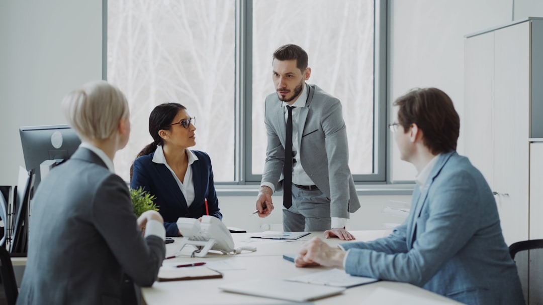 business professionals in a meeting around a table business meeting strategy board team alignment objectives