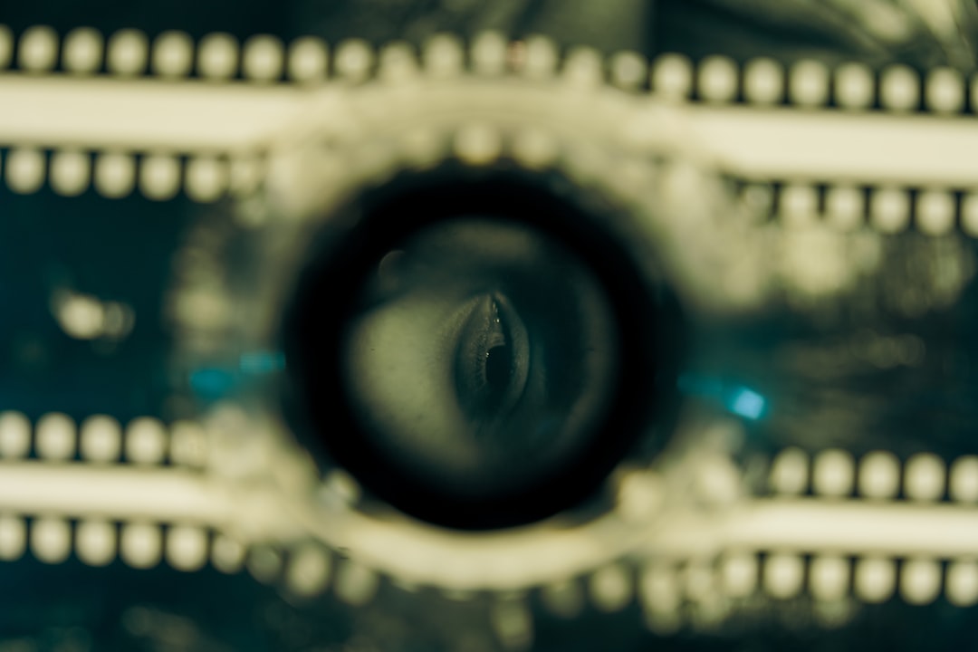 close up of an eye reflected in a film reel lens classic cinema film reels vintage movie poster