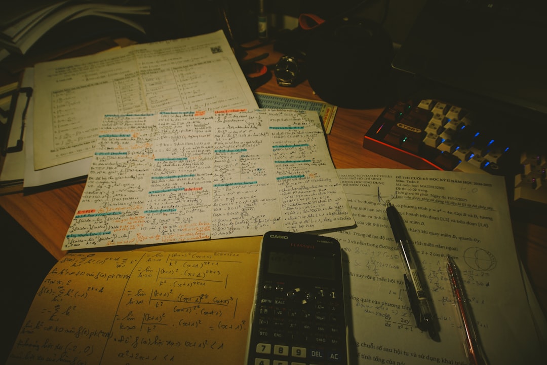 desk with papers calculator and pens aviation charts study desk pilot books flashcards