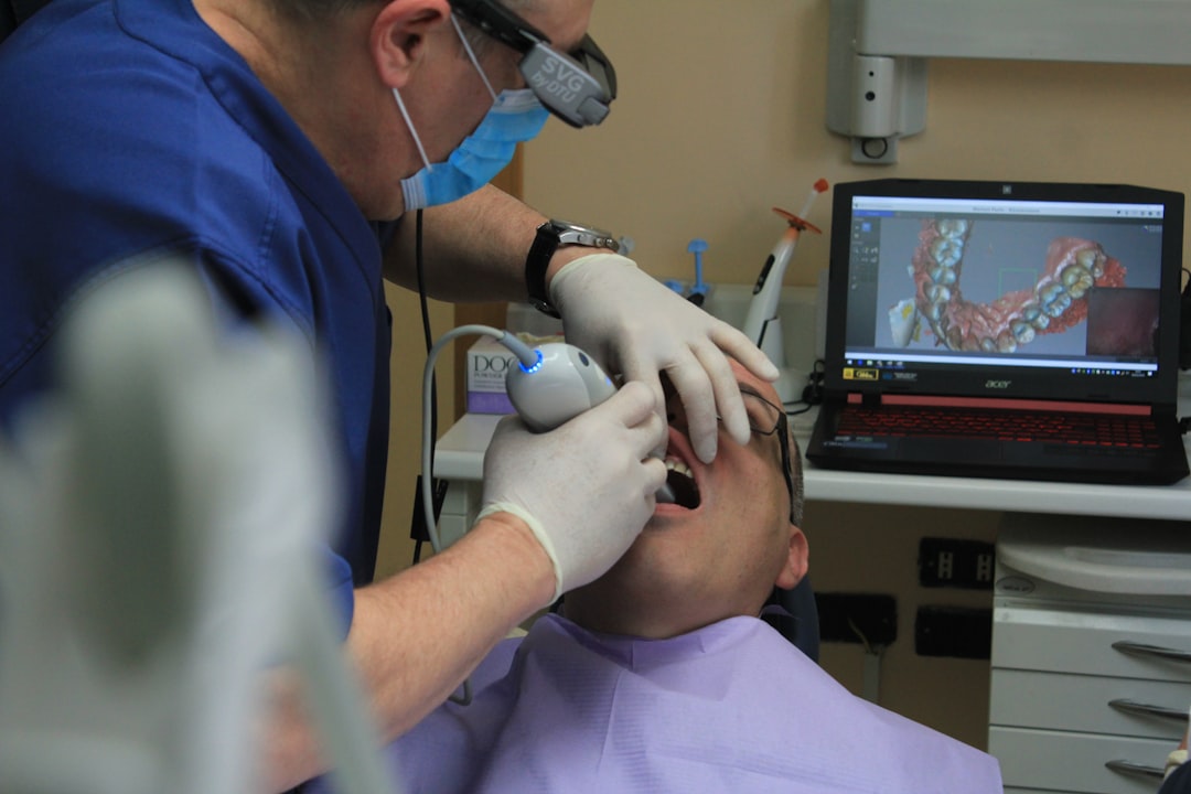 mens blue t shirt digital dental scan intraoral scanner patient chair clinic technology