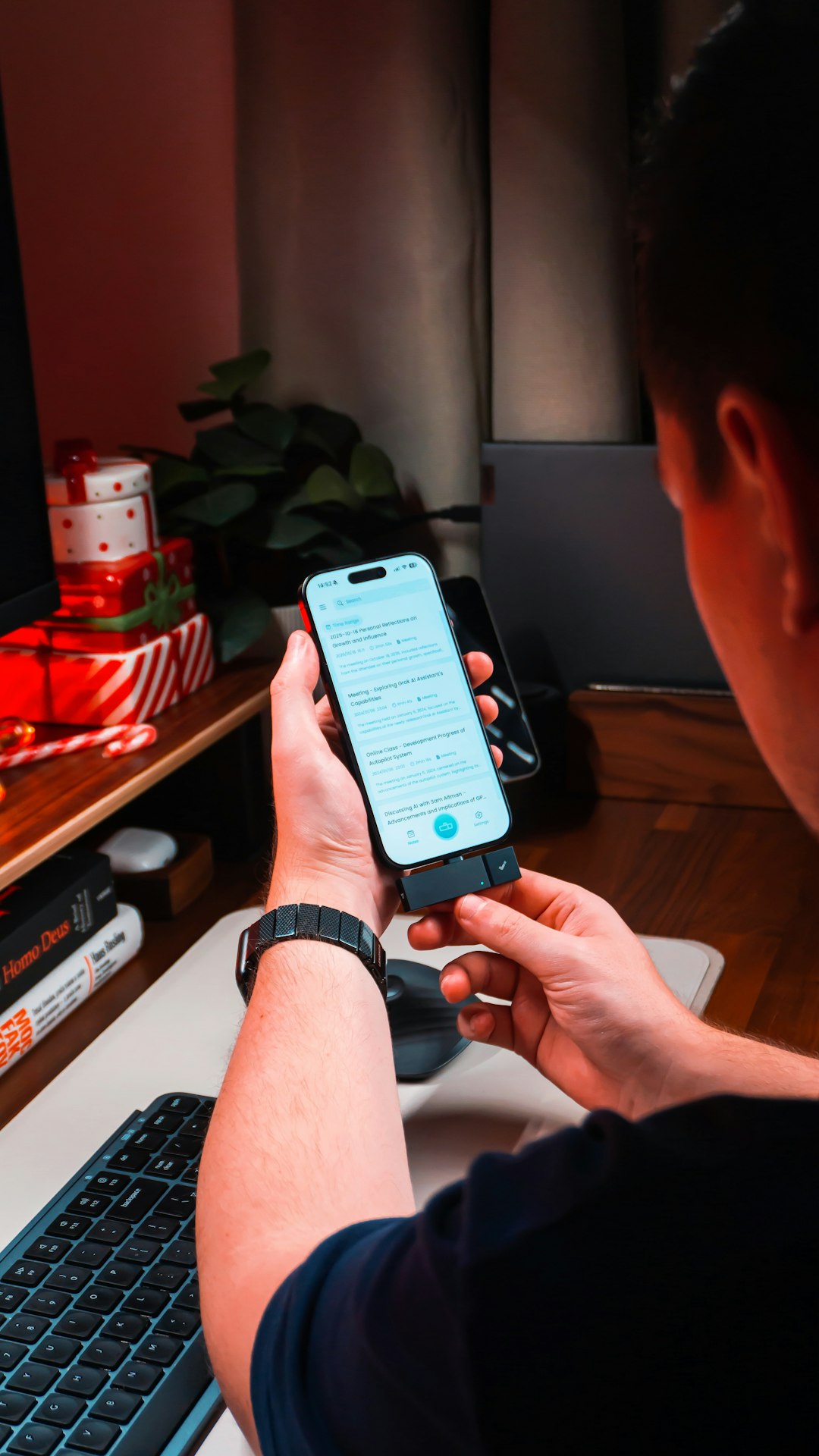 person holding smartphone with text on screen person using ai clear prompts digital assistant