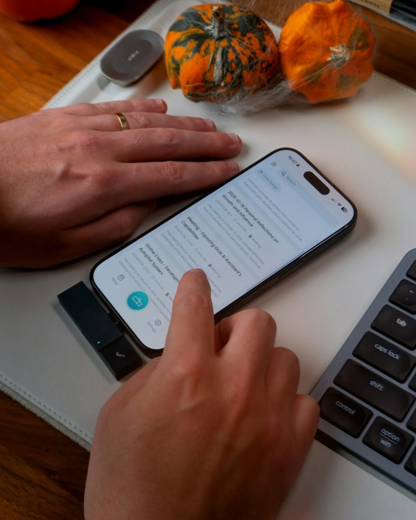 Zero to $5k: A Step-by-Step Guide to Launching a Lending Comparison Site 2 person using smartphone with keyboard and pumpkins person using ai clear prompts digital assistant