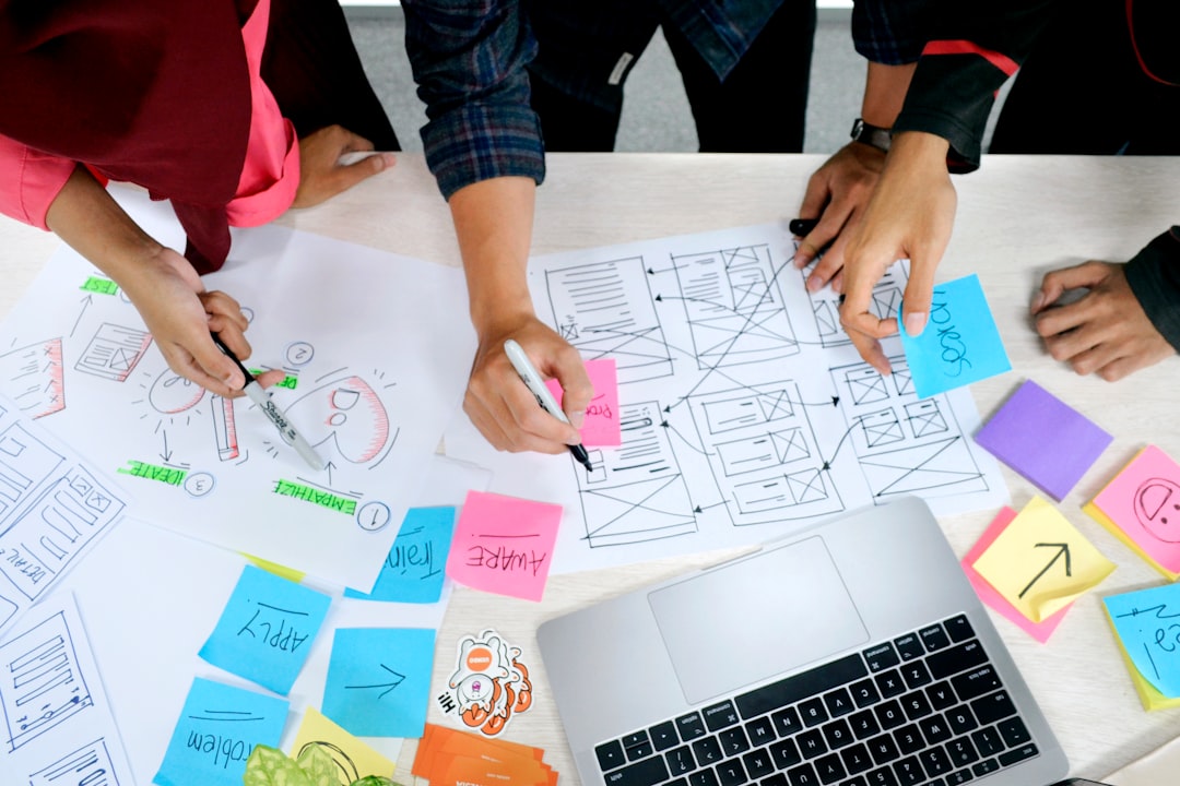 person writing on white paper prototype testing product development engineering team