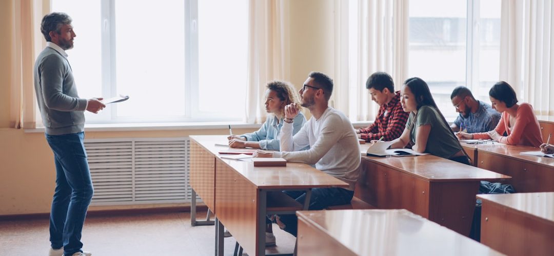 teacher instructing students in a classroom lecture university classroom digital calendar scheduling dashboard