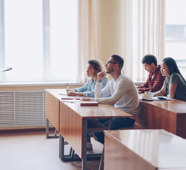 teacher instructing students in a classroom lecture university classroom digital calendar scheduling dashboard