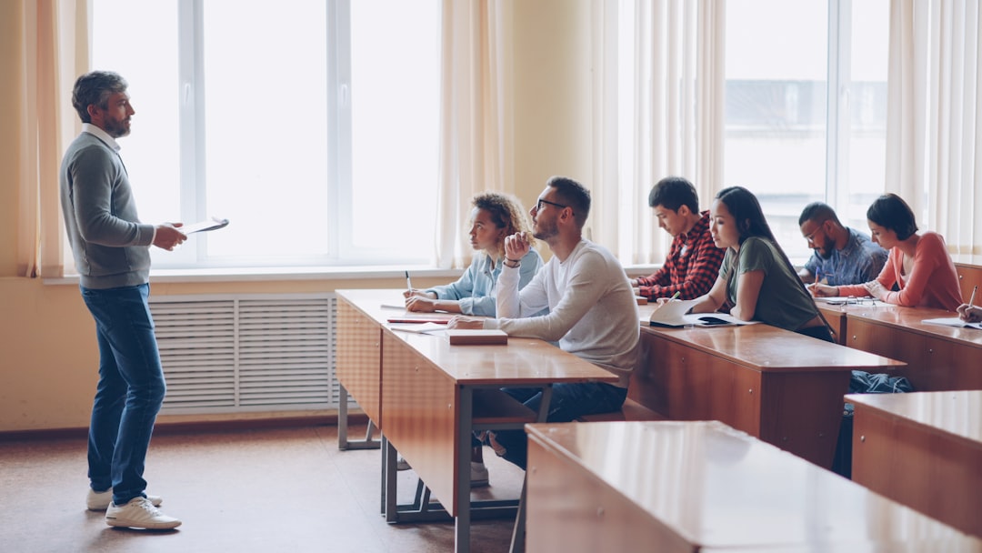 teacher instructing students in a classroom lecture university classroom digital calendar scheduling dashboard