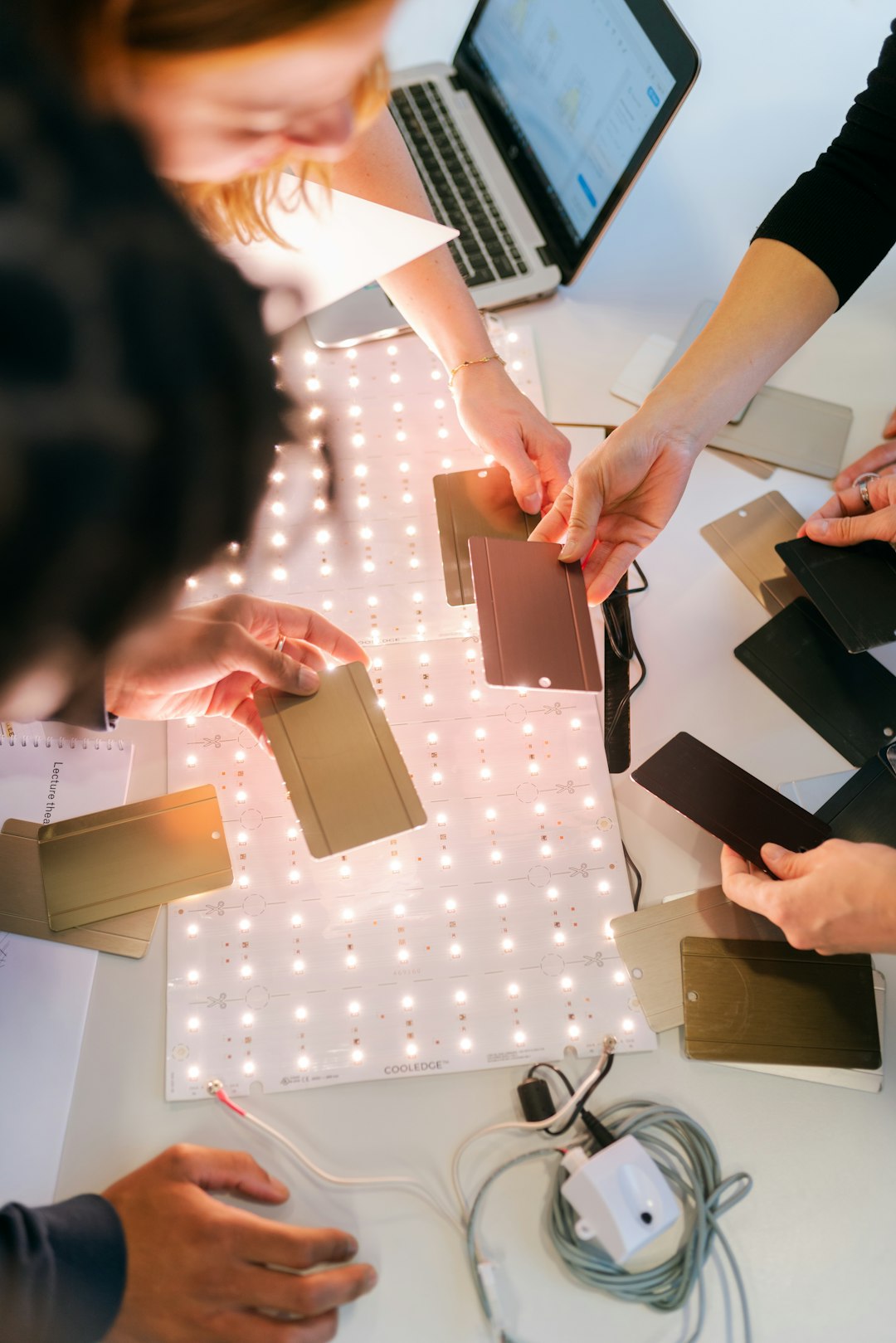 woman holding gold iphone 6 prototype testing product development engineering team