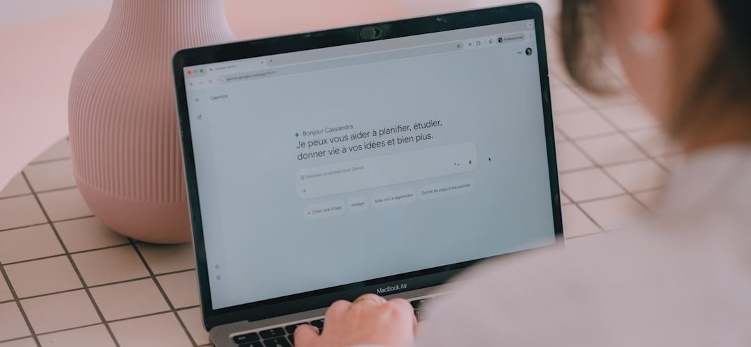 woman typing on a laptop with a vase nearby person using ai clear prompts digital assistant