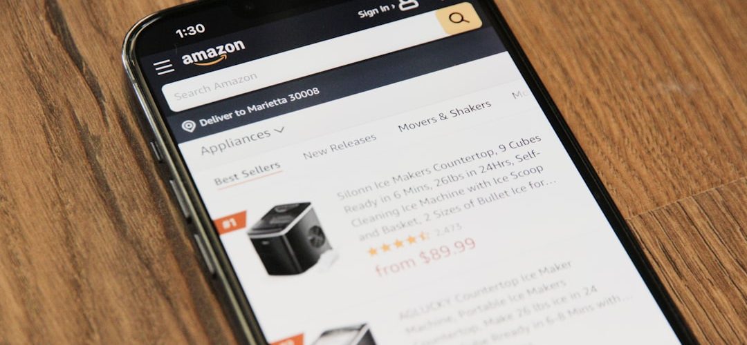 a cell phone sitting on top of a wooden table conversion rate amazon ads sales chart product growth