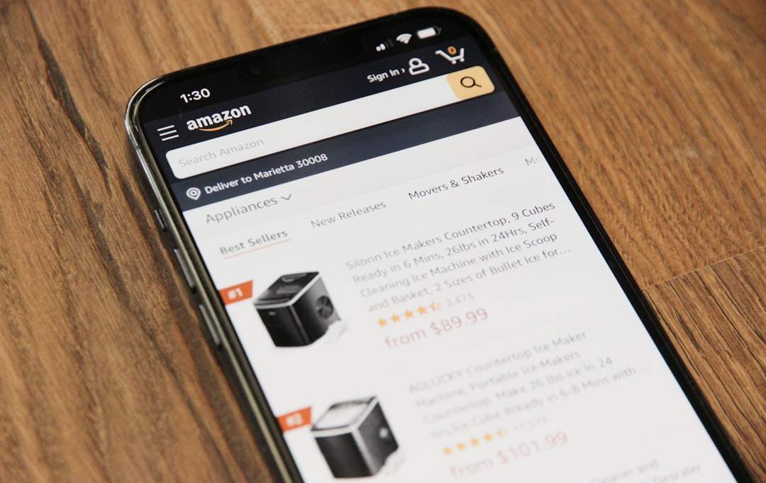 a cell phone sitting on top of a wooden table conversion rate amazon ads sales chart product growth