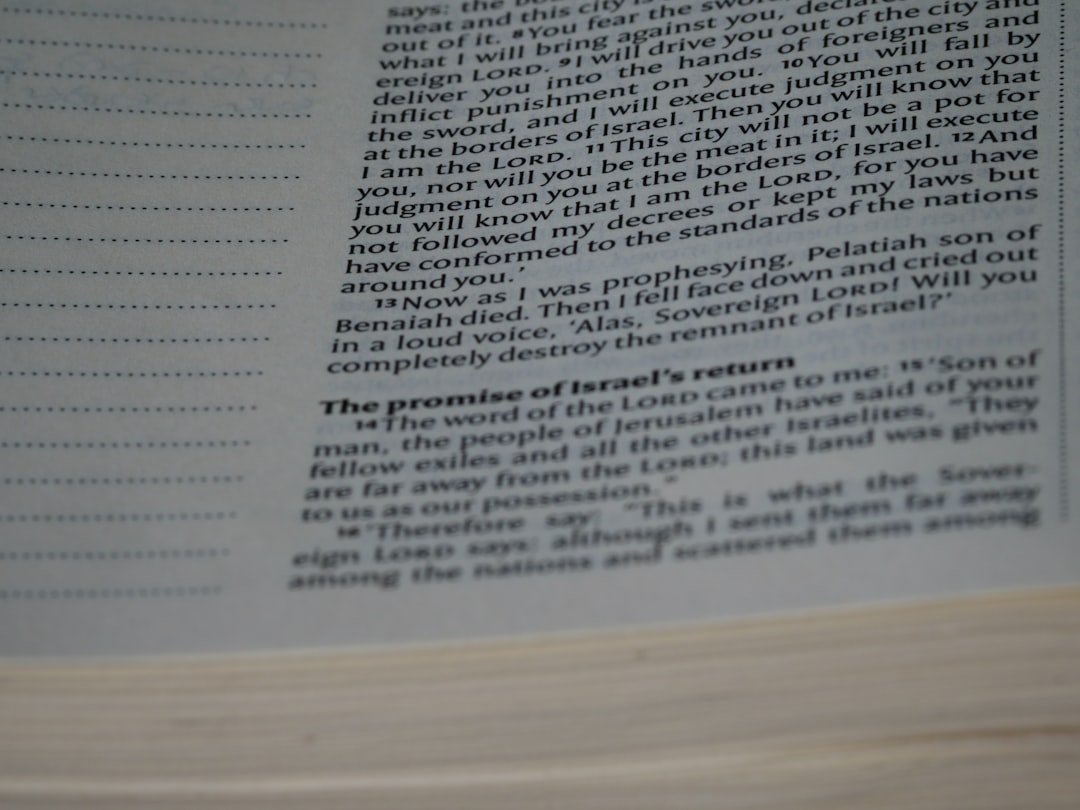 a close up of an open book with text research paper citations footnotes page