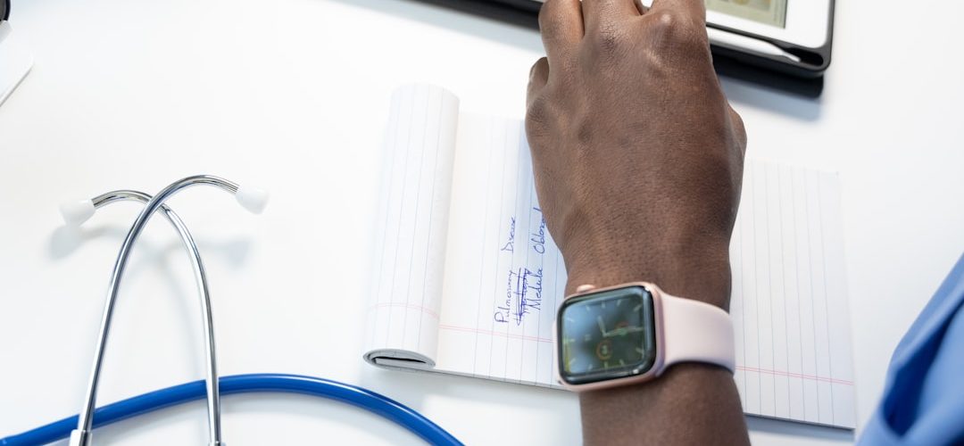 a hand holding a smart watch insurance claims medical coding automated workflow