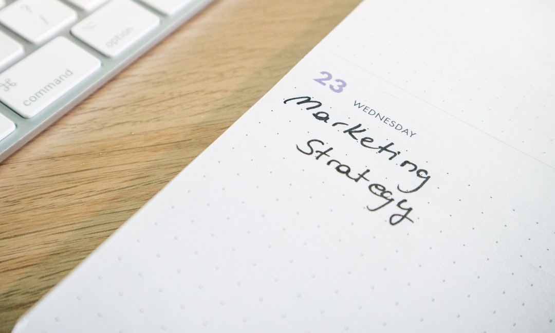 a notepad with the words marketing strategy written on it content strategy notes call to action examples audience growth
