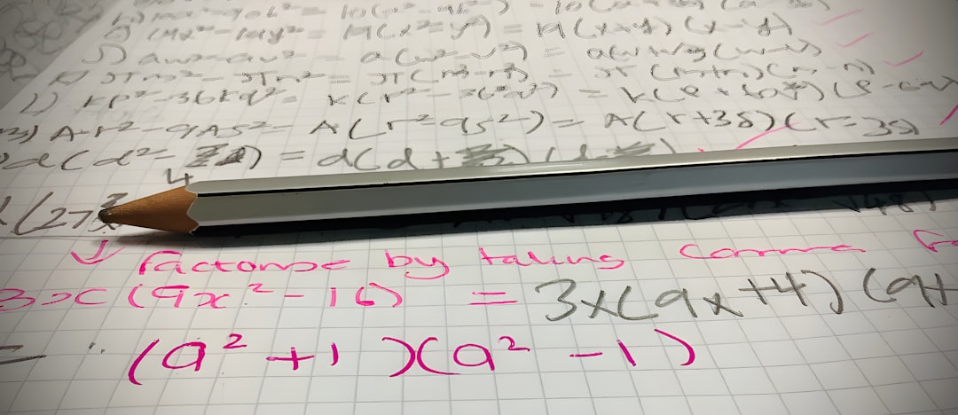 a pencil sitting on top of a piece of paper student solving maths practice questions geometric progression