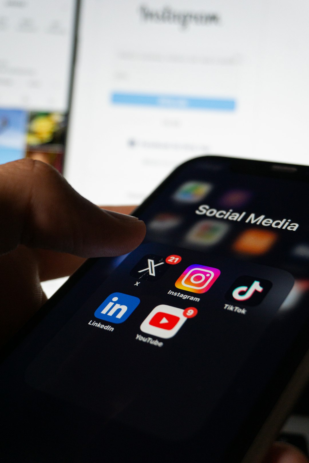 a person holding a smart phone with social media on the screen instagram privacy phone screenshot social media app