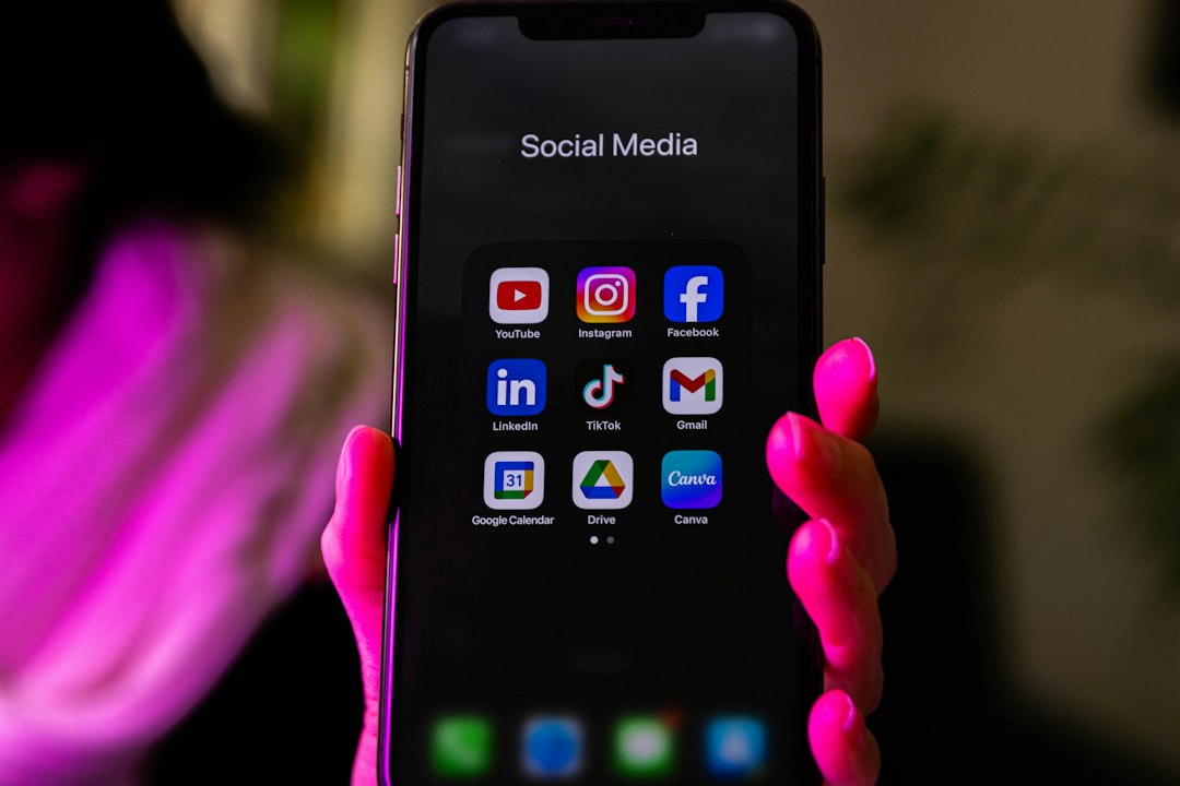 a smartphone displays social media app icons digital ad platforms google meta tiktok linkedin icons marketing chart