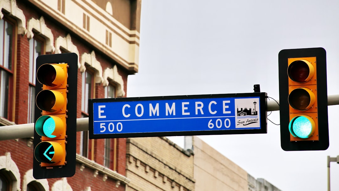 a traffic light with a street sign hanging from its side online store analytics mobile commerce