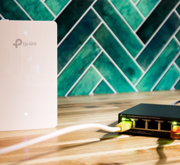 What Is Internetwork Operating System: 7 Key Concepts Behind an Internetwork Operating System 8 a wi fi router and a network switch sit side by side router login page mobile browser home network