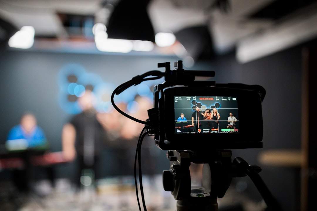 black dslr camera taking photo of city lights voiceover recording subtitles elearning video