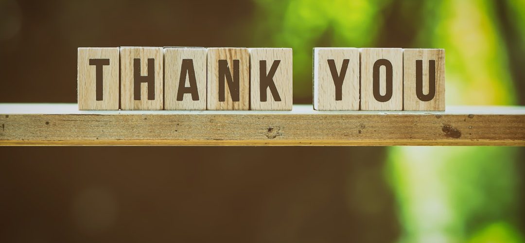 brown and white wooden arrow sign fundraising team donor thank you nonprofit office