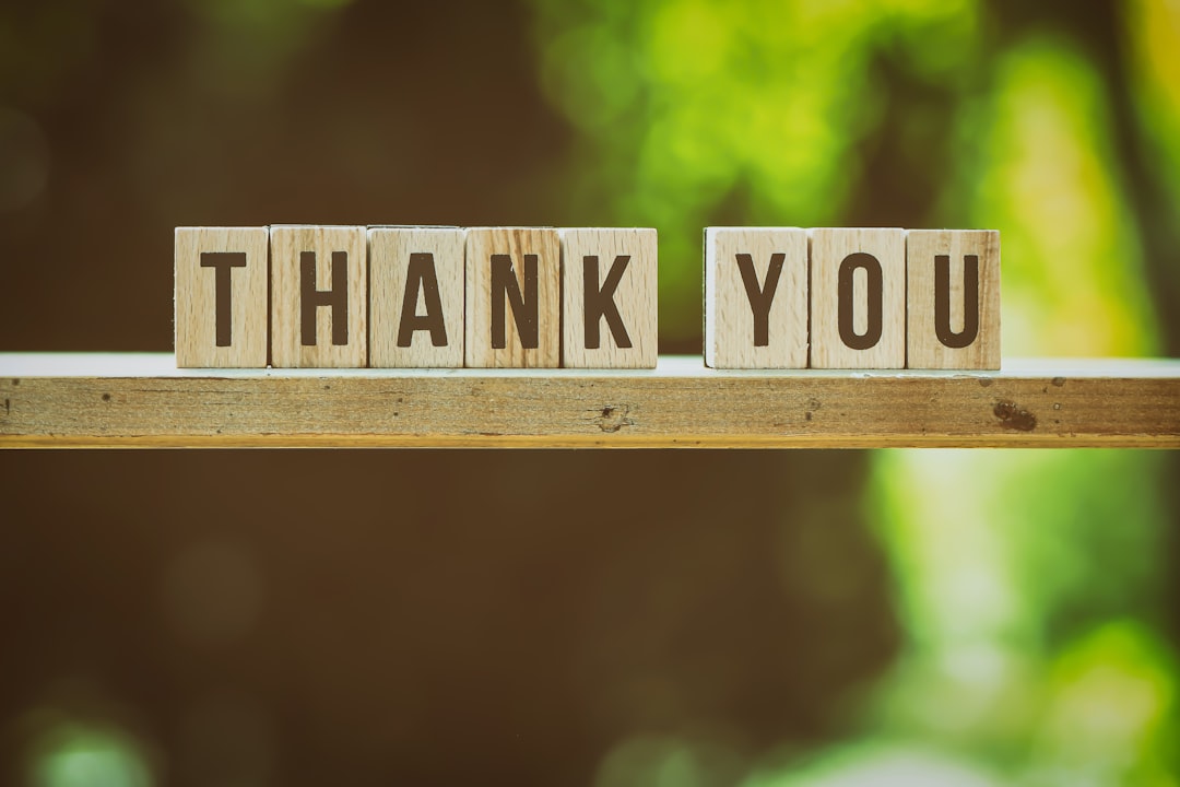 brown and white wooden arrow sign fundraising team donor thank you nonprofit office