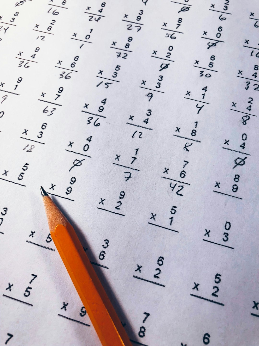 brown pencil on equation paper student solving maths practice questions geometric progression