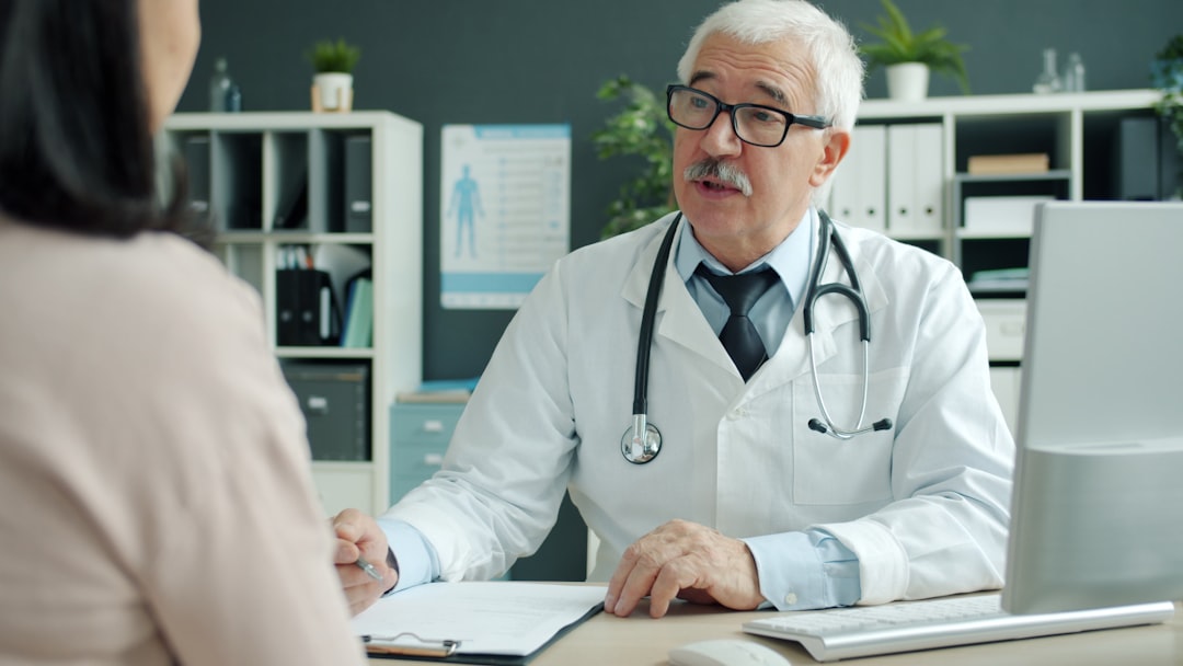 doctor talking to patient in an office doctor office patient payments billing software