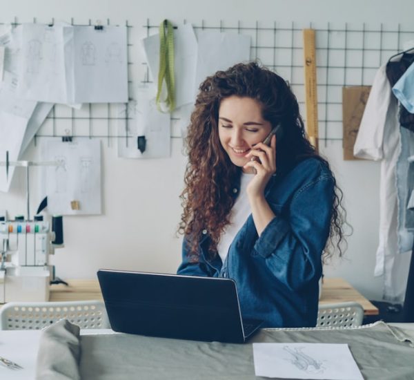 Advantages of Sole Proprietorship: Benefits, Drawbacks, and Examples 9 fashion designer on the phone working on a laptop small business owner laptop chat bubbles