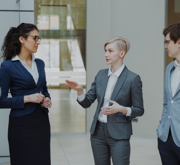 How to Ask for the Price of a Service Professionally 8 four business professionals in a meeting discussing ideas sales team customer discussion business value