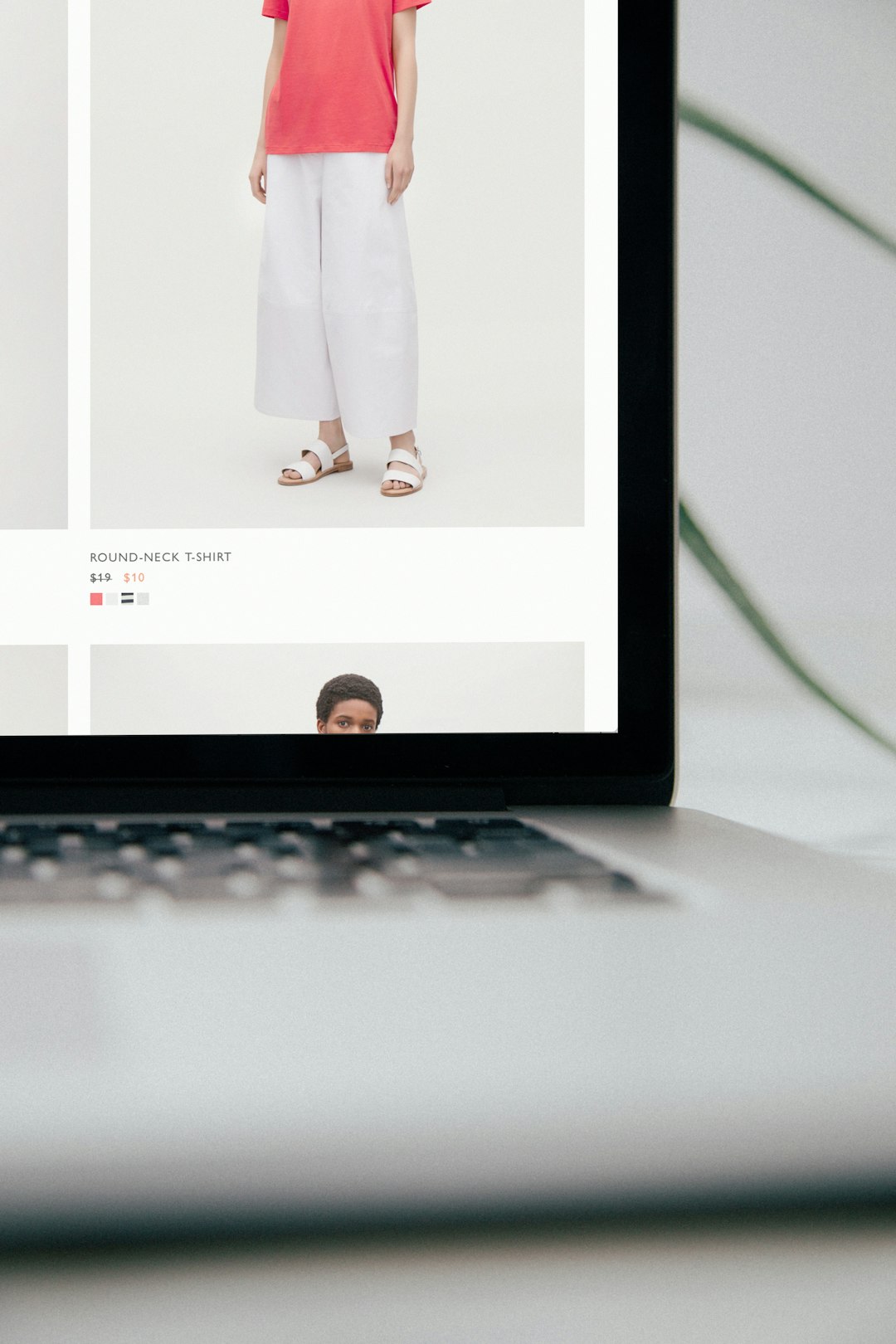 laptop computer displaying mango pants online shopping product images catalog organization