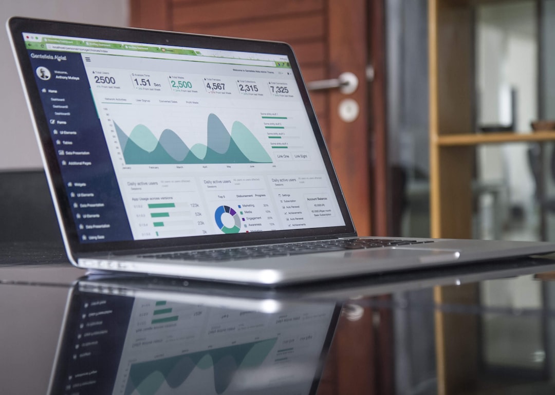 laptop computer on glass top table small business owner customer data marketing strategy
