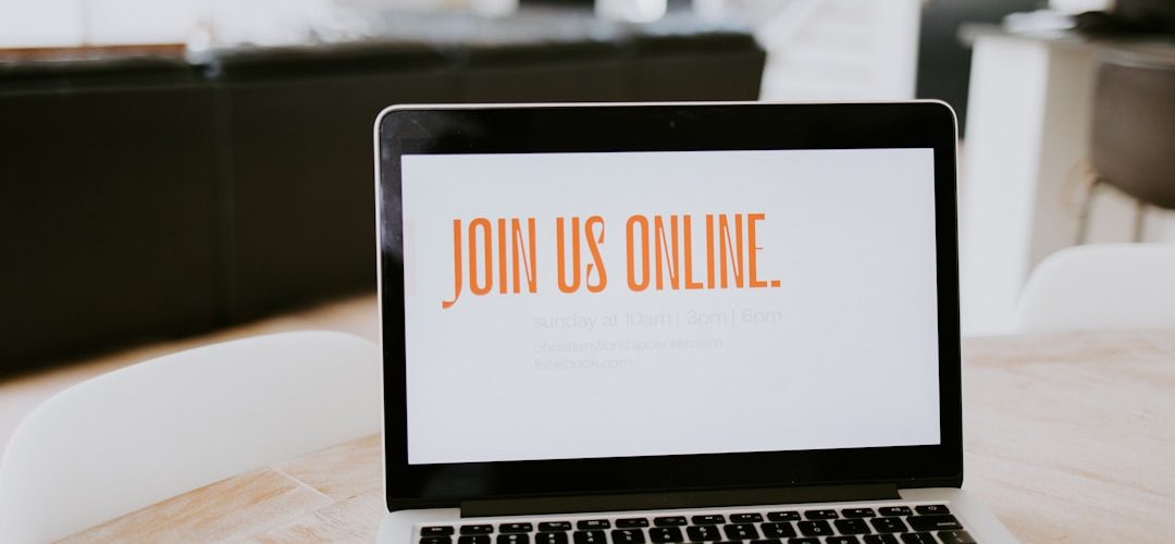 macbook pro on brown wooden table webinar registration online presentation laptop audience