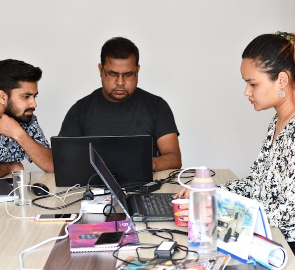 How a Reply Bot Can Automate Repetitive Customer Questions 9 man in black crew neck t shirt sitting beside woman in black and white floral dress customer support problem solving professional team