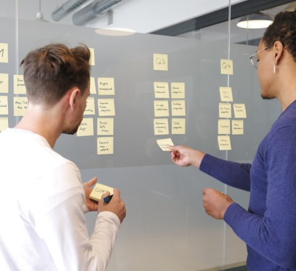 man in blue long sleeve shirt holding smartphone product roadmap planning team collaboration customer feedback