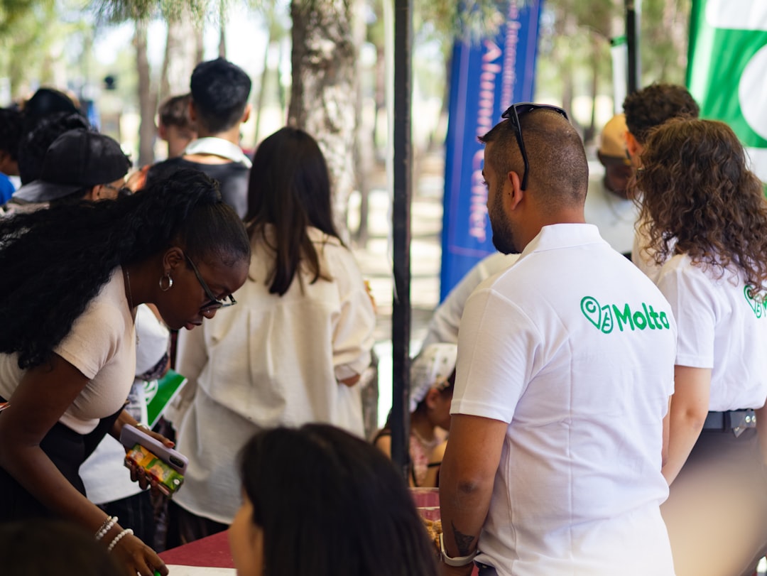 people gathered at an outdoor event some wearing local networking community event business links