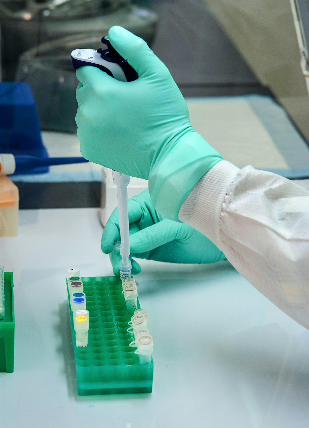 person in white long sleeve shirt holding green and white labeled can single cell analysis immune cells laboratory research