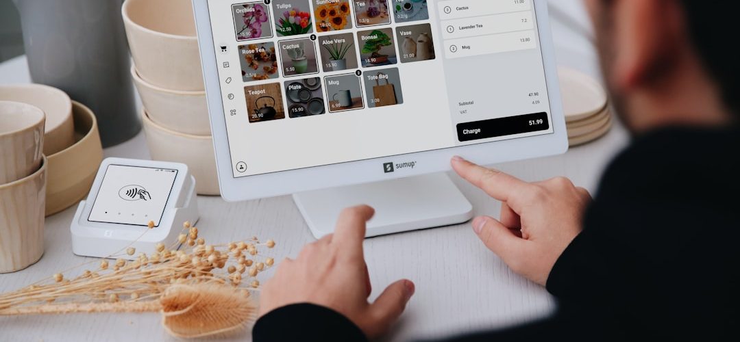 person using a tablet at a stores checkout multichannel sales marketplace orders inventory sync
